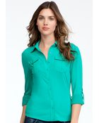 Bebe Patch Pocket Jersey Button Up Blouse - Lyst