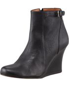 Lanvin Buckled Wedge Ankle Boot - Lyst