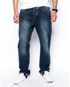 Asos Loose Jeans In Mid Wash - Lyst