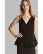 Halston Heritage Top - Sleeveless Notched Neck Peplum With Ruffle Detail - Lyst