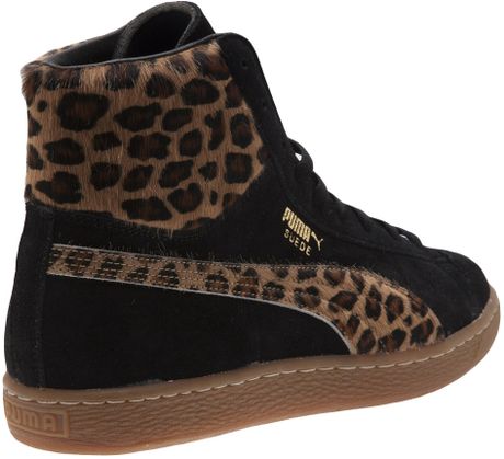 leopard and black trainers