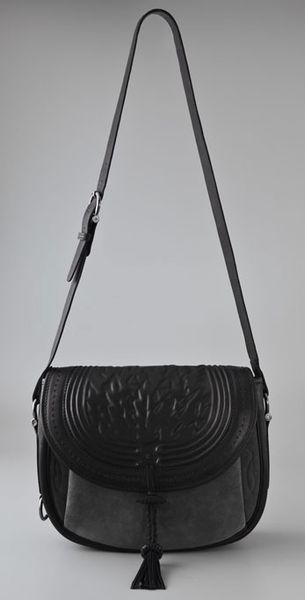 black tooled leather bag