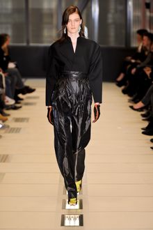 Balenciaga Fall 2012 Techno Fabric Oversized Full Length Jumpsuit With Parachute Wide-Leg Pants, Asymmetrical Closure, Sculpted Darted Top With Dropped Shoulders In Black  - Lyst