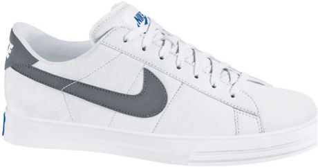 white and grey nike tennis shoes