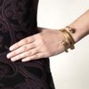 Alexander Mcqueen Spiral Twinskull Bracelet in Gold - Lyst