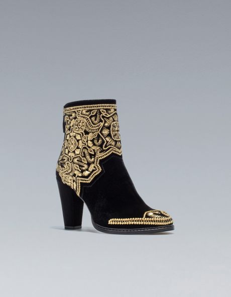 black and gold flat ankle boots