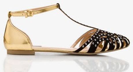 black flats with gold trim
