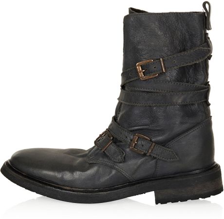 gray boots with buckles