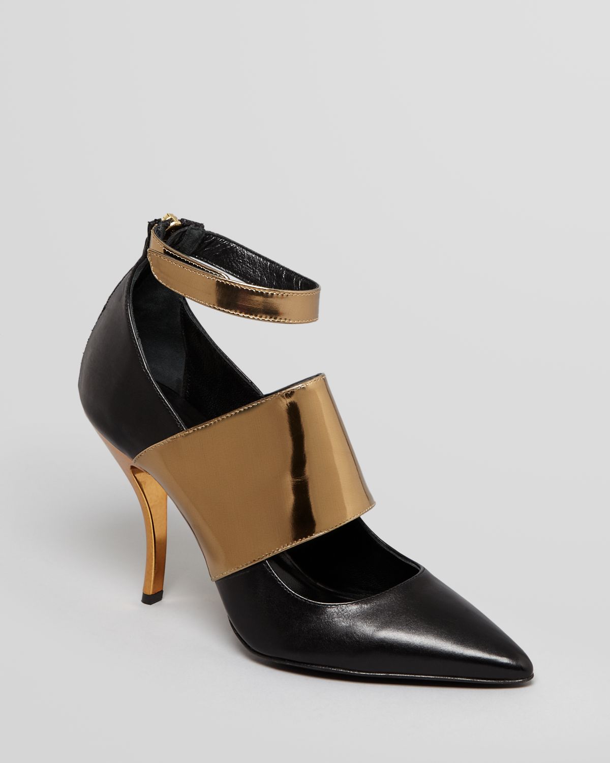 black heels with gold toe