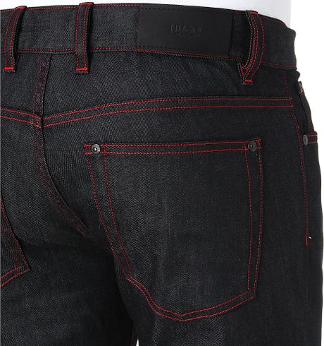 black jeans with red stitching