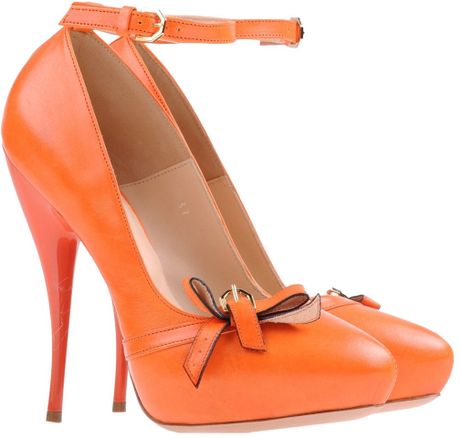 orange platform pumps