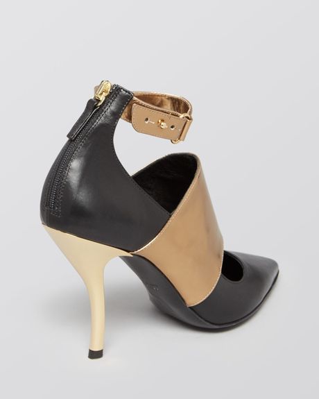black heels with gold toe