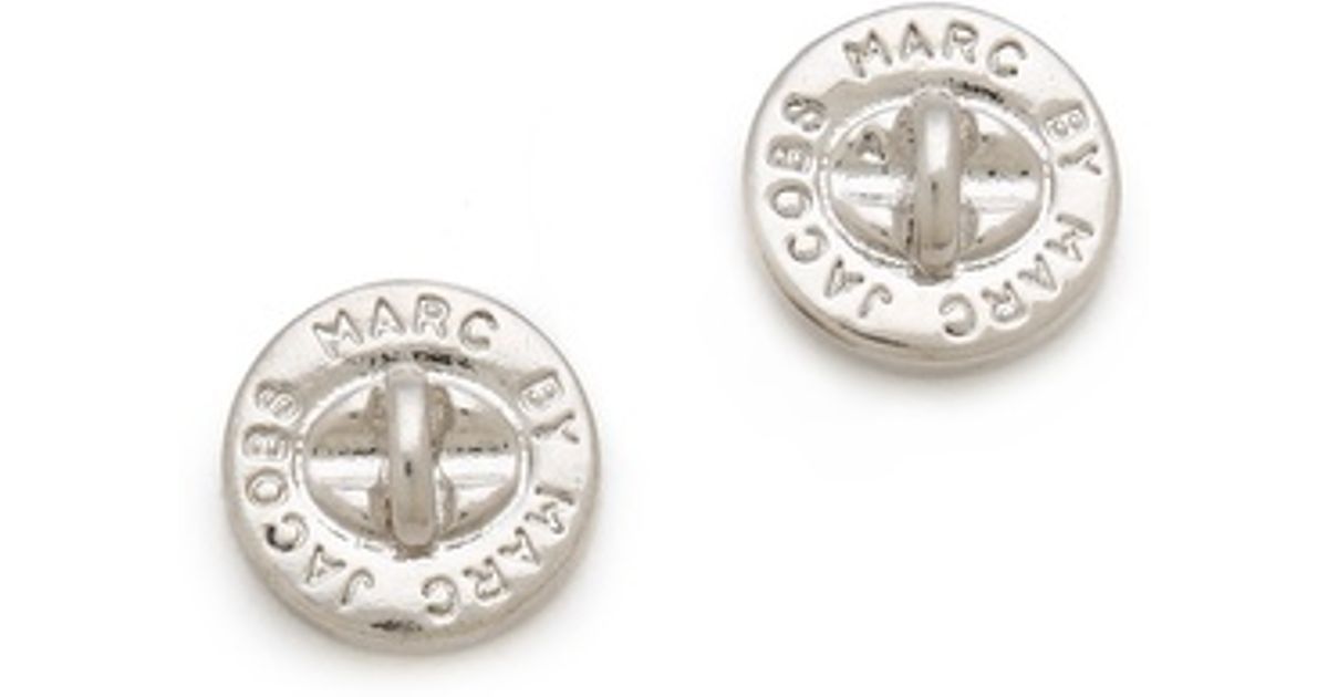 Lyst Marc By Jacobs Turnlock Stud Earrings In Metallic