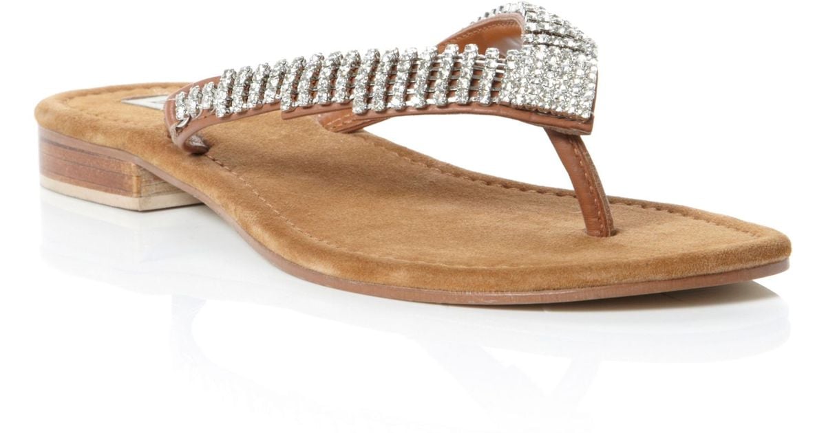 dune tan flip flops
