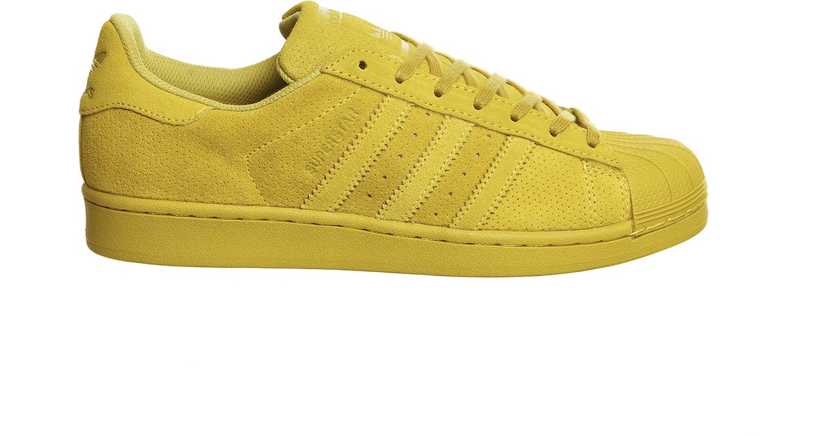 yellow adidas superstars