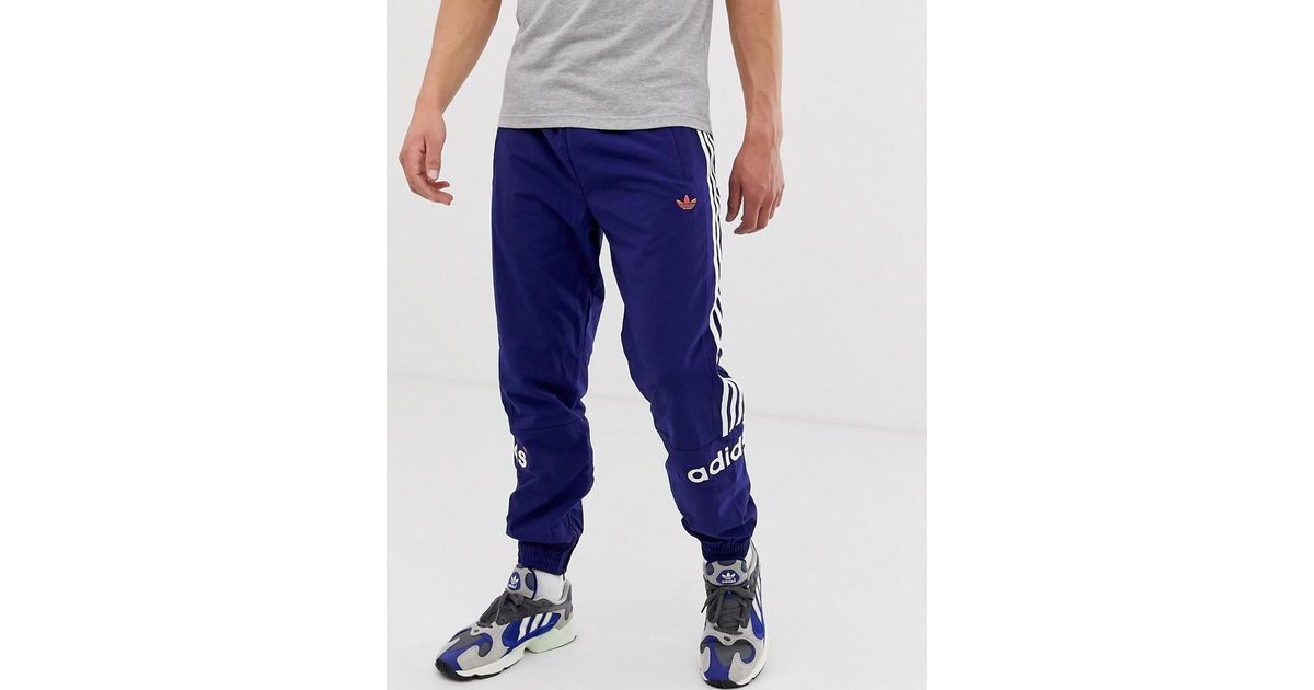 Adidas Originals FH7903 Gewebte Jogginghose in Marineblau mit 3 Streifen in Blue für Herren Adidas Originals Lässiges Dreiblatt T Shirt Grau Herren