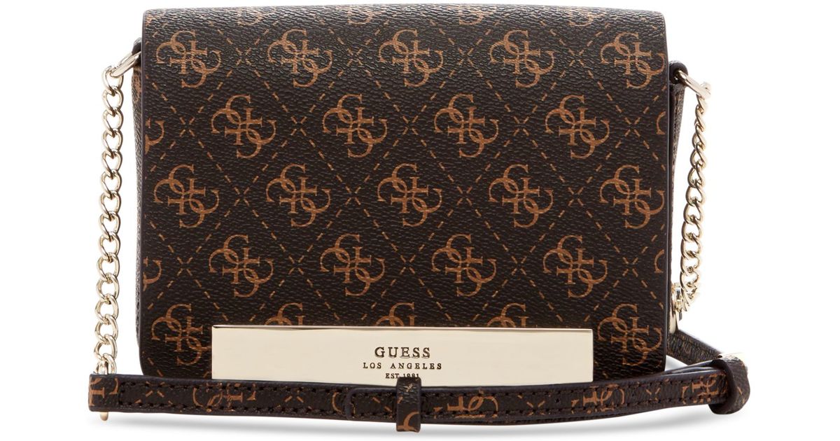 Lyst Guess Isla Pee Flap Mini Crossbody Bag In Brown