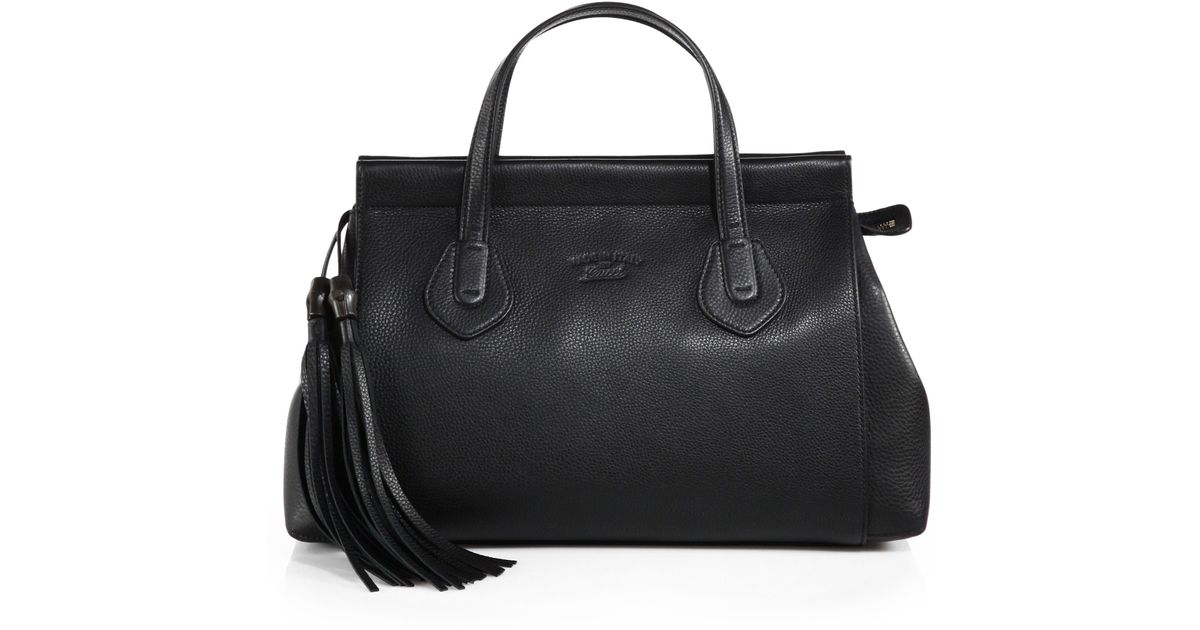 black gucci purse with tassel