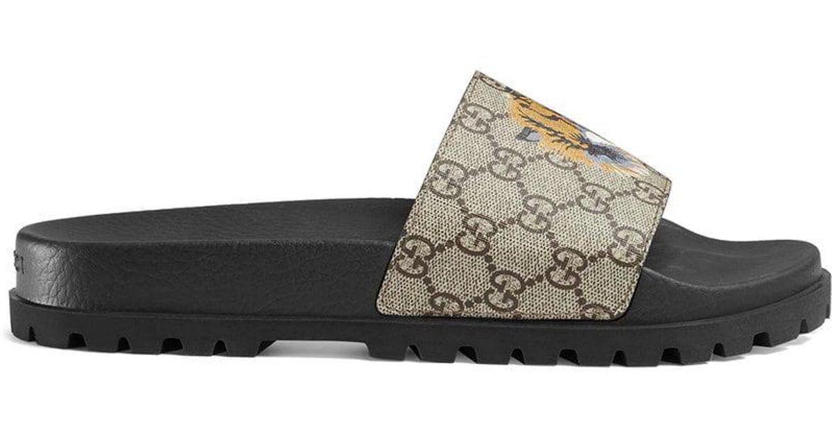 gucci tiger supreme slides