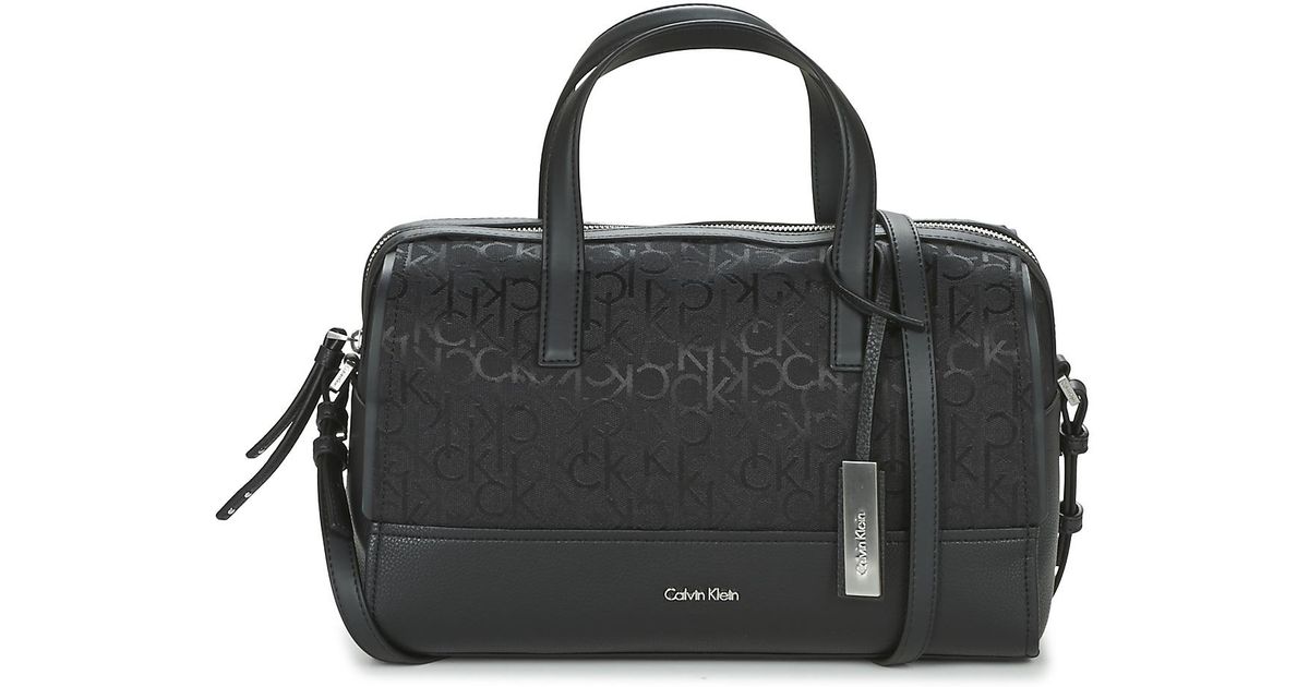 Calvin Klein Jeans Marina Logo Duffle Handbags In Black Lyst