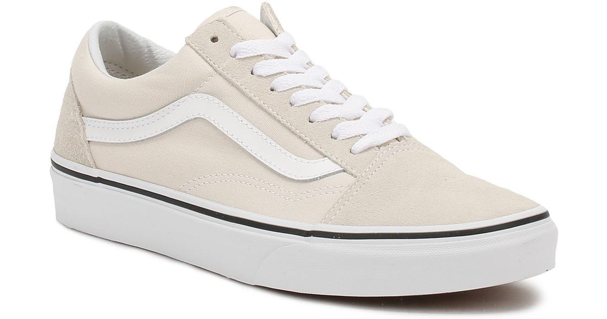 tan and white vans