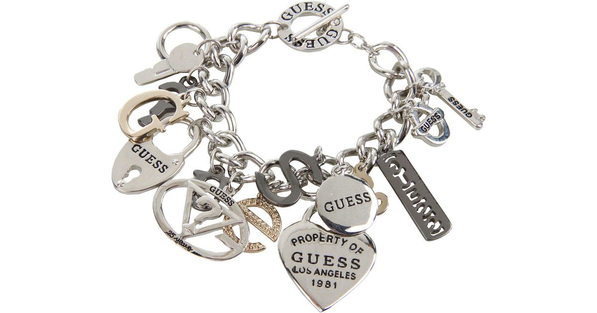 Lyst Guess 179167 21 Ir Hemae Gold Charms Bracelet In Pink