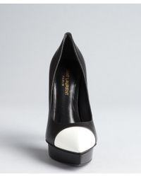 black pumps with white cap toe
