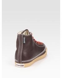 brown leather converse hi tops