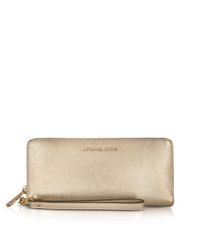 Michael Kors - Jet Set Travel Large Pale Gold Metallic Leather Continental Wallet - Lyst