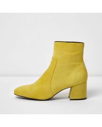 yellow block heel boots