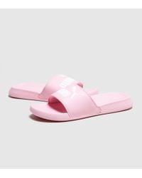 pink and white puma slides