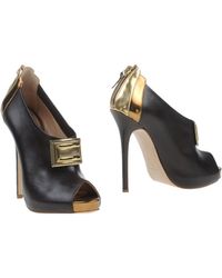 Charlotte Olympia Zena Suede and Leather Ankle Boots in Gold (black) | Lyst