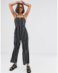 Bershka Tuta jumpsuit nera con intaglio sul davanti - Nero
