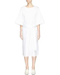 the row white gown