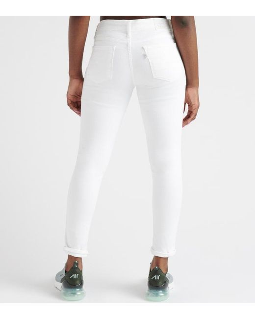 Levi's 711 Destructed Skinny Ankle Jeans in White - Lyst