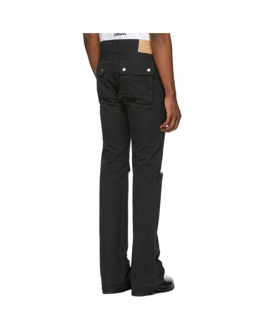 ripped jeans with black patches