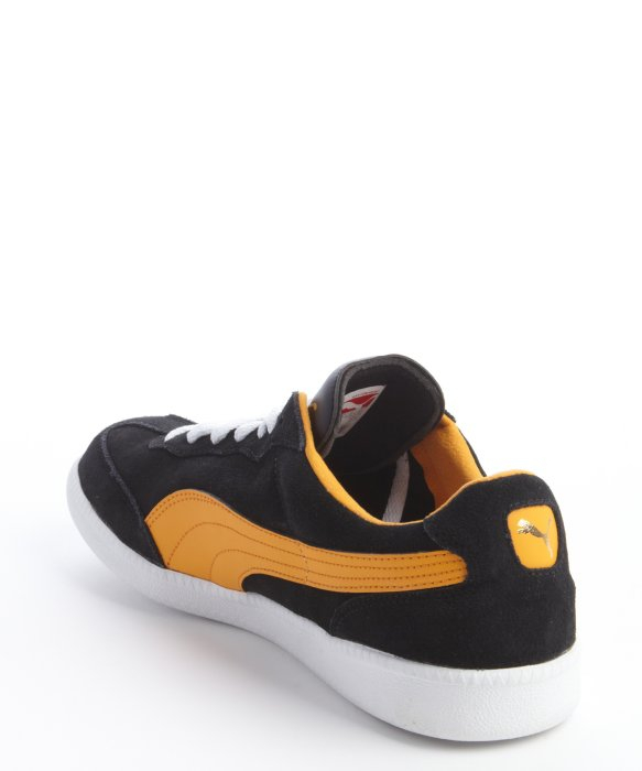 puma black and orange sneakers