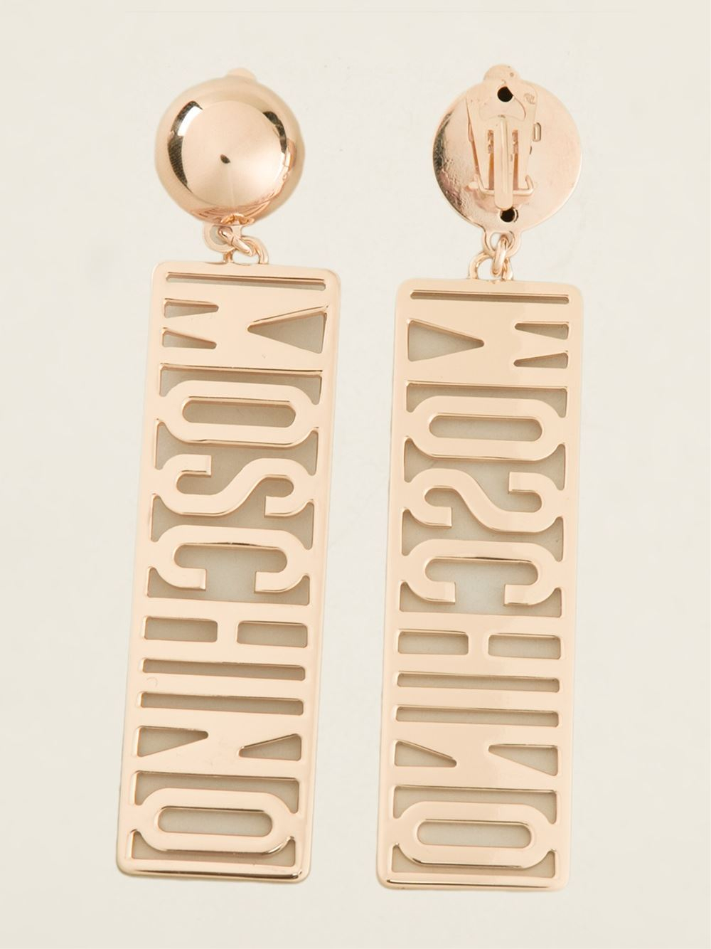 Lyst - Moschino Logo Plate Earrings in Metallic