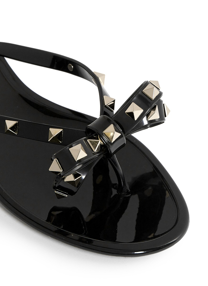 Lyst - Valentino 'rockstud' Bow Flat Jelly Sandals in Black