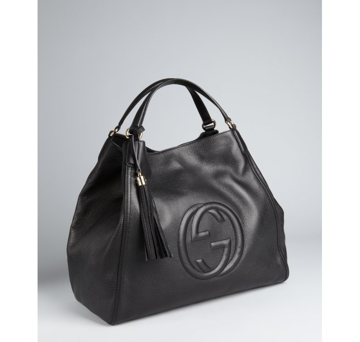 black gucci purse with tassel