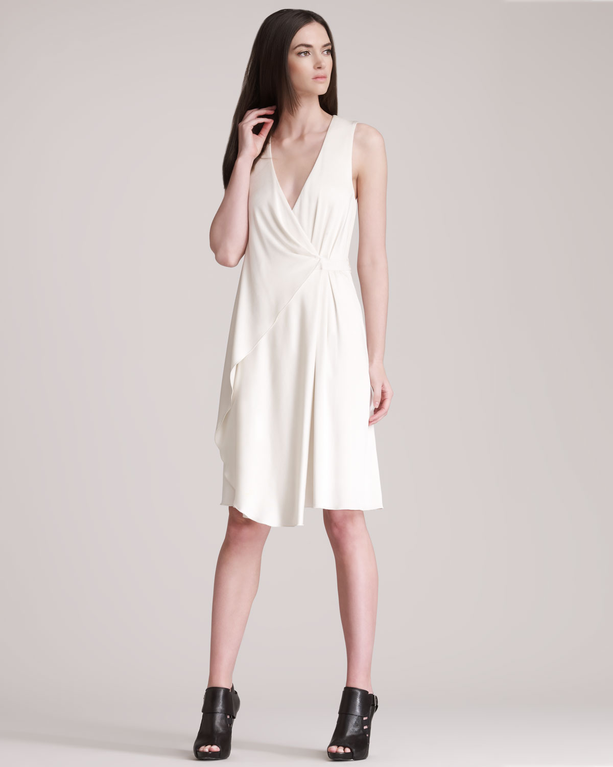 white sleeveless wrap dress