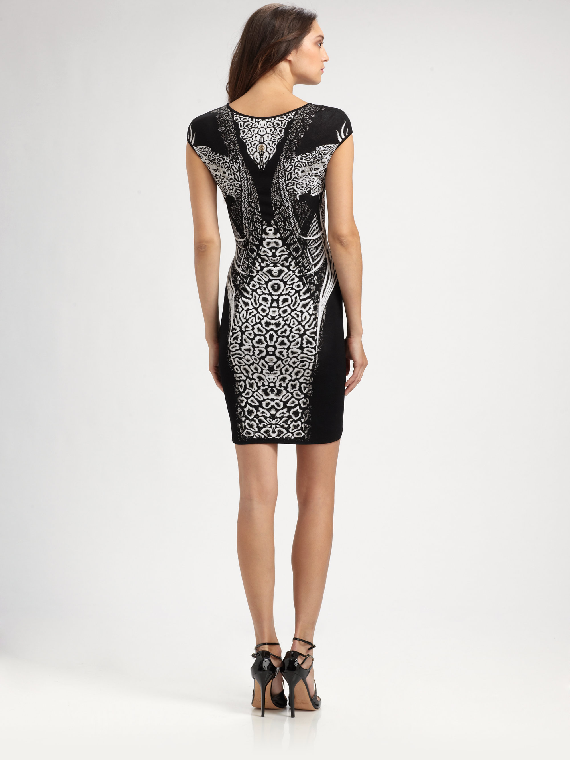 Roberto cavalli leopard print dress Leopard-print sheer silk-chiffon dress with designer stamp within the print. Roberto Cavalli dress has a boned bodice, ruched paneling at the bodice, exposed stitch detail on the fabric-covered boning, concealed underwired cups, exposed stitch detail at back, exposed zip fastening at back, has a train at back, and is fully lined. silk; lining: % silk.