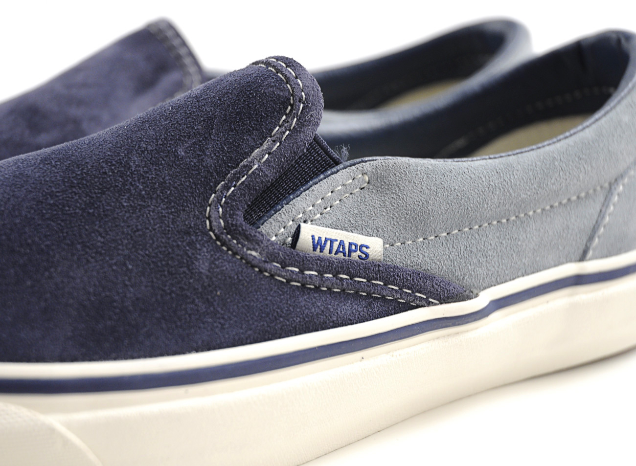 navy blue slip on vans