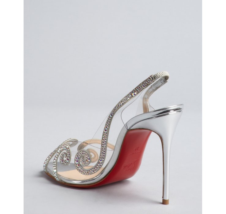 silver and clear pumps