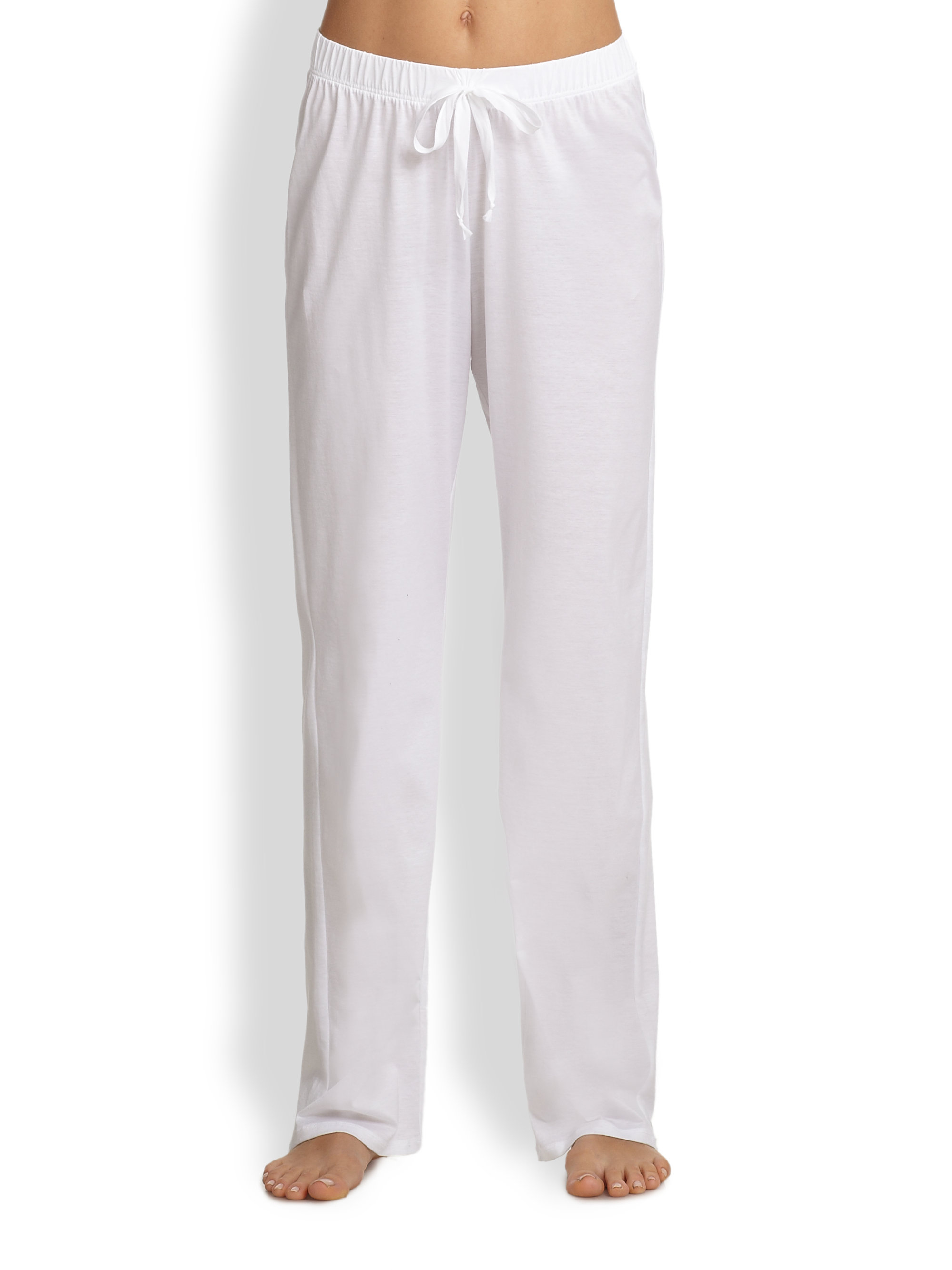 Woman wearing white drawstring lounge pants