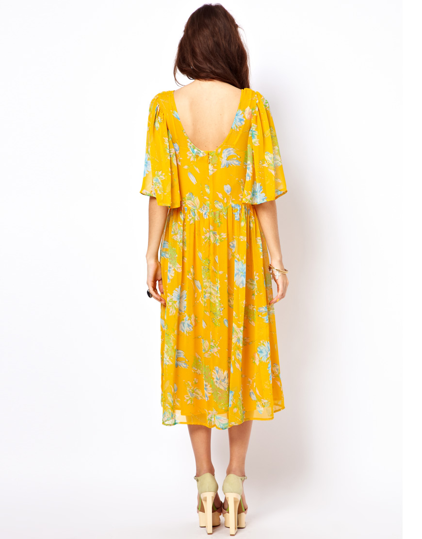 Yellow midi dress with sleeves