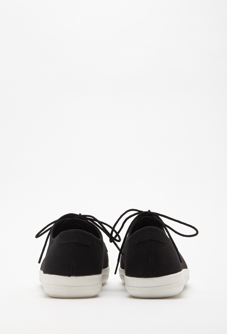 ladies black canvas plimsolls