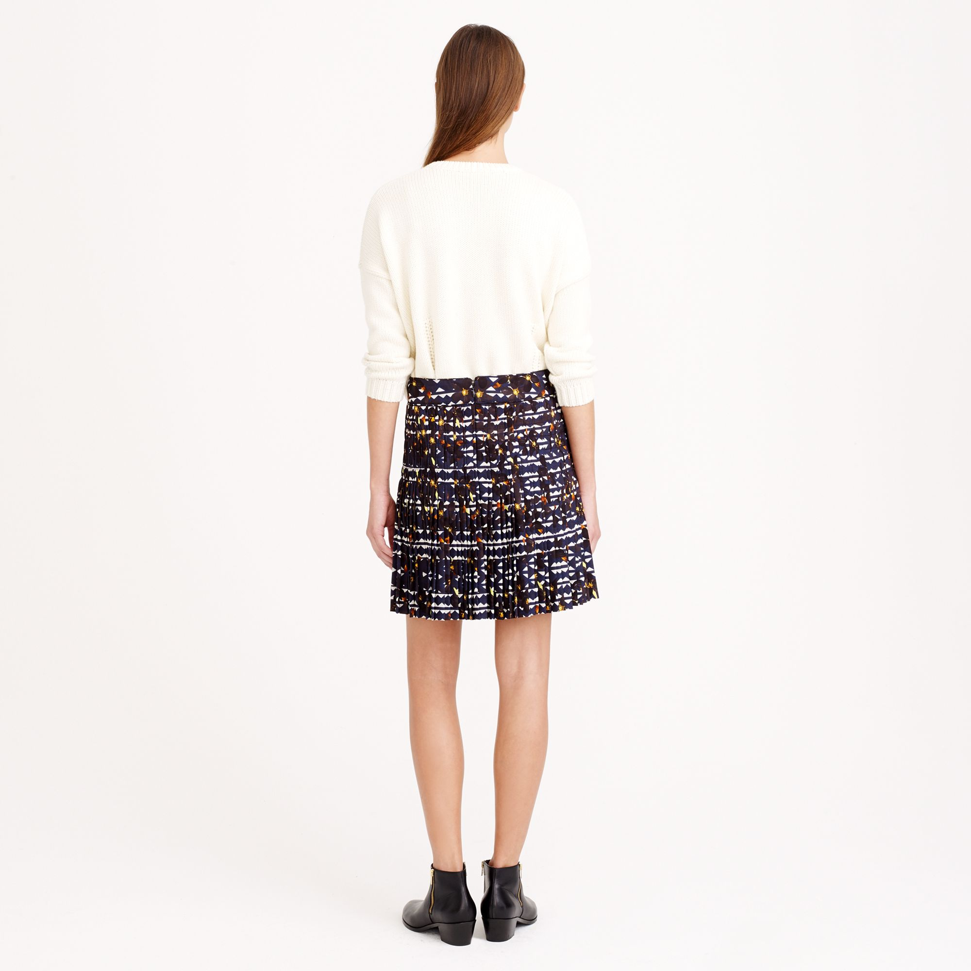 crew neck and pleated skirt