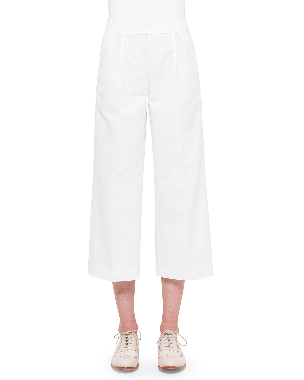 woman in white wide leg crop pants