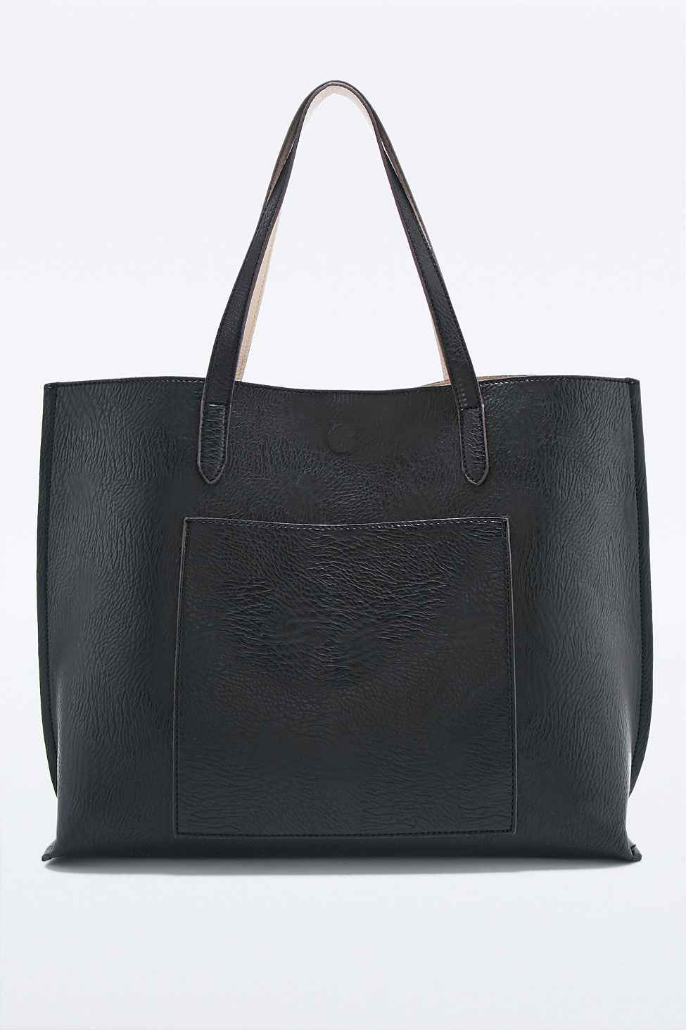 Urban outfitters Reversible Vegan Leather Pocket Tote Bag In Black And Ivory in Black | Lyst